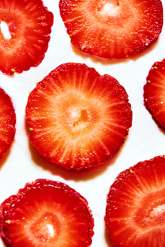 Sliced bright red strawberries.
