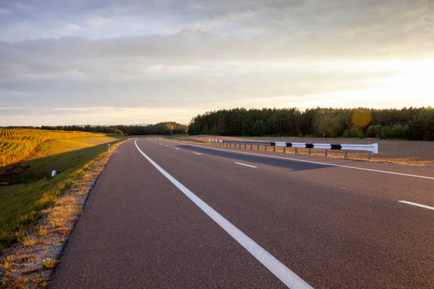 istock paved highway in the countryside 1393117342