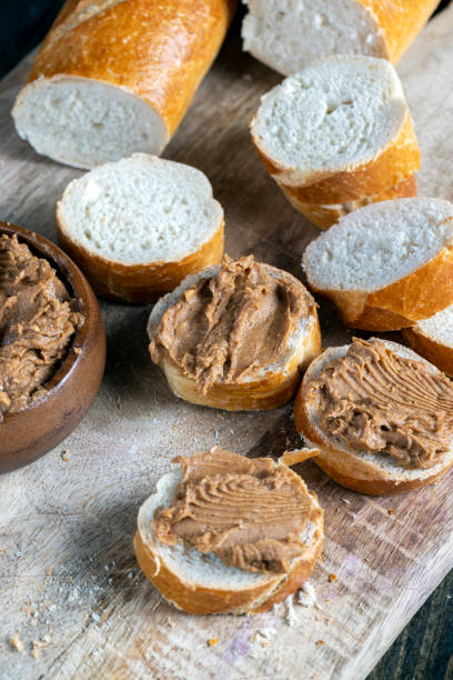 istock peanut paste with pieces of peanuts and white baguette 1393117419