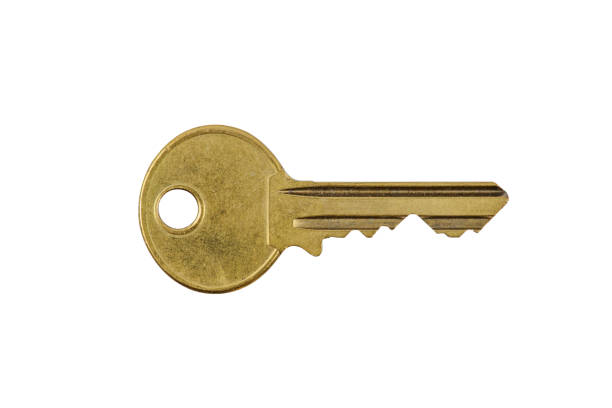istock Used safety key, brass with scratches, clipping-path, macro shot 1393120426