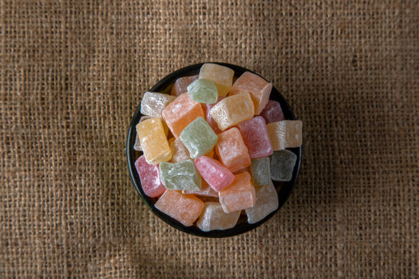 istock Traditional Turkish delight in a bowl on a burlap background 1393120593
