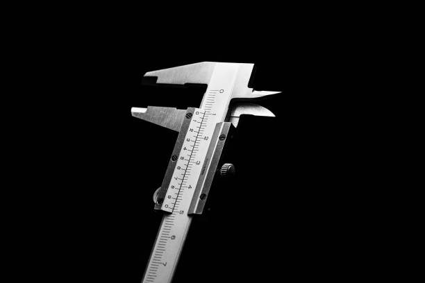 Metal vernier caliper on dark background