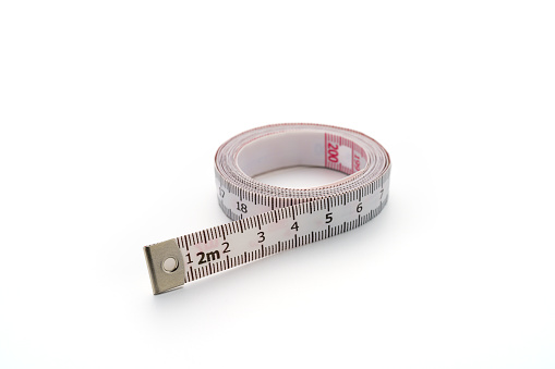 White measuring tape isolated on white background