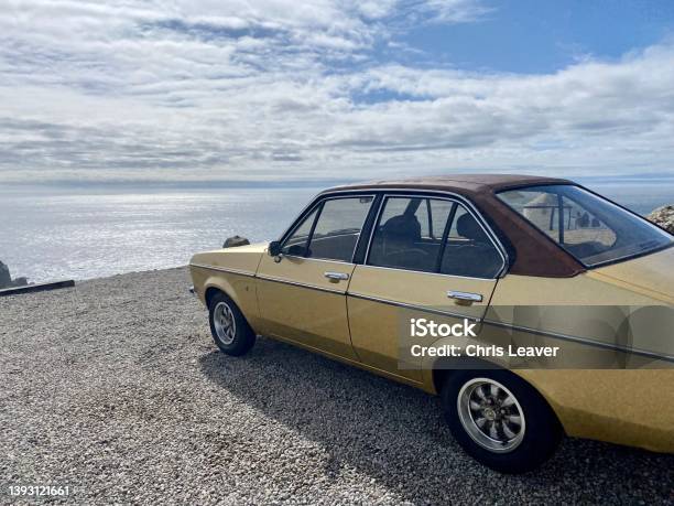 Classic Car Parked On Cornish Cliff Overlooking Sea Stock Photo - Download Image Now
