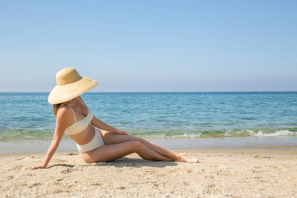 istock Young woman on the beach 1393126183