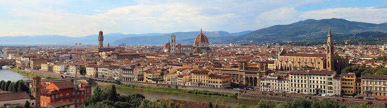 awesome city view of Florence in Italy with Arno River and more landmarks and big Dome of Cathedral and bell towers