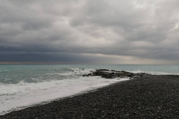 istock Seascape during a thunderstorm with dramatic sky and rocky breakwaters, Bordighera, Imperia, Liguria, Italy 1393130400