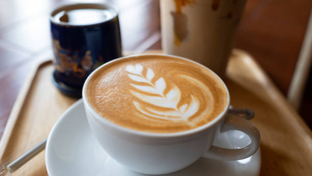 istock hot latte art coffee on wood table, relax time 1393133065