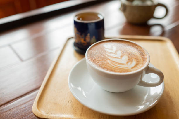 istock hot latte art coffee on wood table, relax time 1393133075