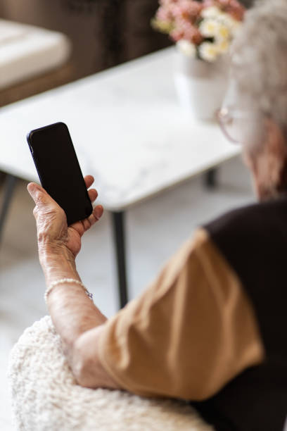 istock Closeup shot senior using smartphone 1393133983