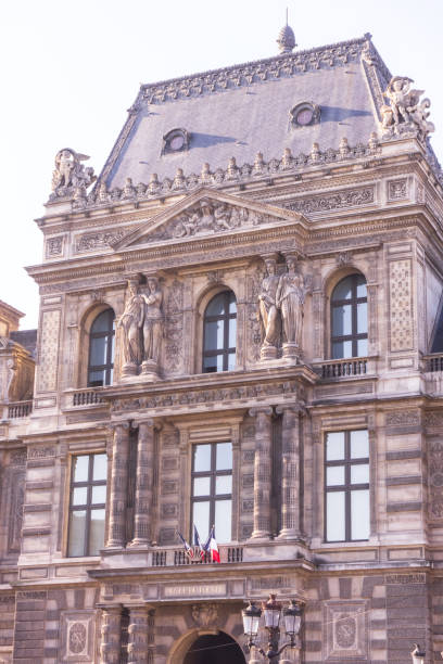 Institut de france building featuring its iconic dome and french flag under an overcast sky