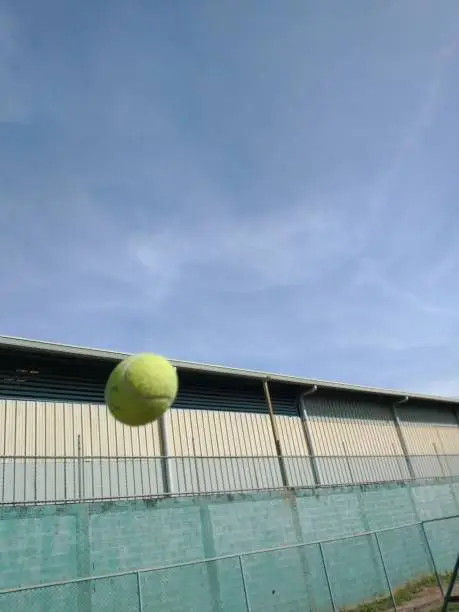 Photo of tennis ball flying through the air