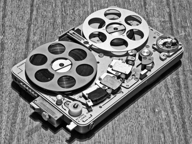 Miniature reel-to-reel audio recorder from 70's Miniature reel-to-reel audio recorder from 70's. (Black And White Photo) reel to reel tape stock pictures, royalty-free photos & images