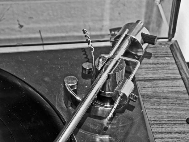 istock Close up of gramophone handle with with tuning system - pressure forces of handle on a disk vinyl 1393142615