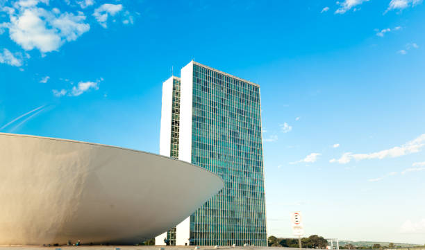 the national congress of brazil. building designed by oscar niemeyer. it is composed in the chamber of deputies and the federal senate. - parliament building fotos imagens e fotografias de stock