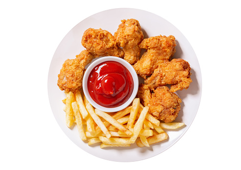 plate of fried chicken with french fries isolated on white background, top view