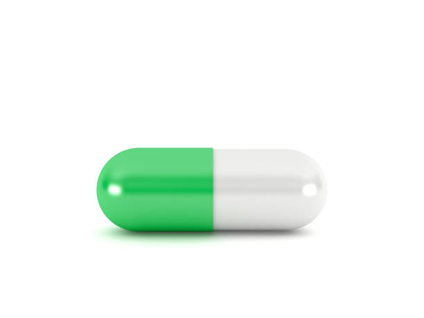 Green pill capsule isolated on white background, 3d rendering stock photo