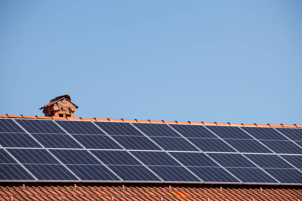 istock Solar panels on a house roof 1393152299