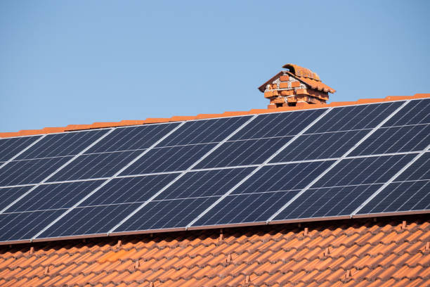 istock Solar panels on a house roof 1393152311
