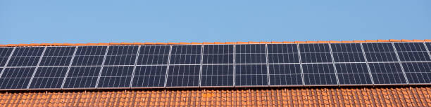 istock Solar panels on a house roof 1393152315