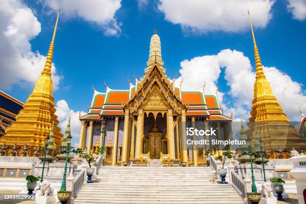 Beautiful Building Of Wat Phra Kaew Temple Of The Emerald Buddha Grand Palace On The Cloudy Blue Sky Day The Most Famous Spot And Must Visit Place And Temple In Bangkok Thailand From The Front Door Stock Photo - Download Image Now