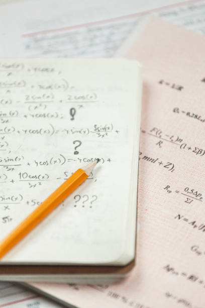 istock Math formulas are written in pencil on a piece of paper, math problems 1393154278