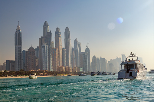 View of the Dubai Marina and JBR area and the famous Ferris Wheel and golden sand beaches in the Persian Gulf,UAE