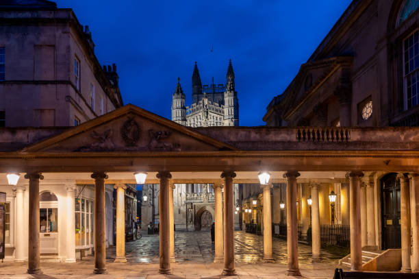 Colonnade of Roman Baths next to Abbey in Bath town. stock photo