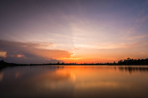 Colorful sky on sunset at the lake in the park landscape