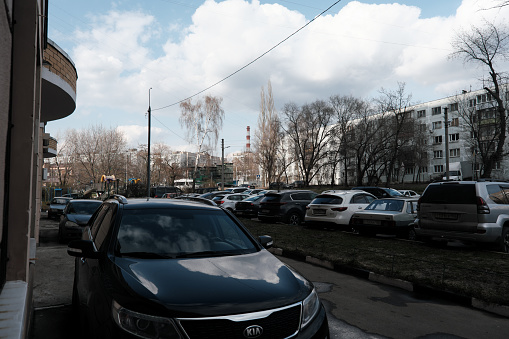 Moscow oblast', Russia - April 23, 2022: Large group of domestic cars parked on sidewalk