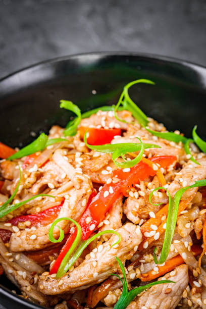 istock delicious chinese fried noodles on a black background 1393157438