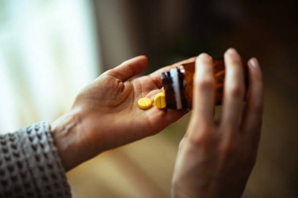 istock An Anonymous Woman Taking Medicine At Home 1393158772