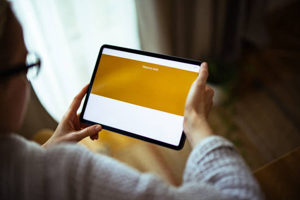 istock Unrecognizable Woman Using Digital Tablet At Home 1393158804