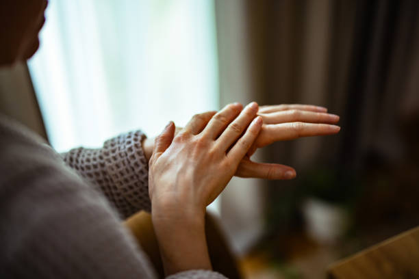istock Unrecognizable Woman Applying Hand Cream 1393158817