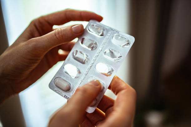 istock An Anonymous Woman Taking Medicine At Home 1393158836
