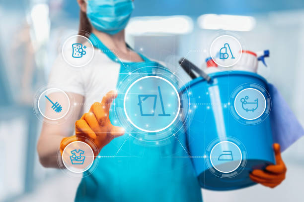 istock Cleaning lady clicks on icon on virtual screen. 1393163830
