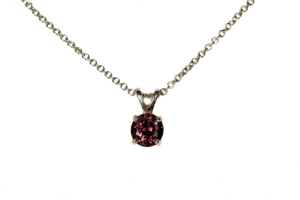 istock Red Zircon pendant, silver chain. White background. 1393164449