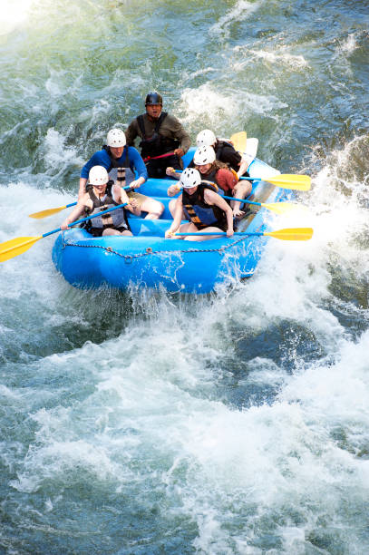 Group of people whitewater rafting on Class 3 rapids, Pacuare River, Costa Rica. Costa Rica is the central American country north of Panama that is renowned for its tropical birdlife, exotic wildlife and adventure pursuits such as whitewater rafting, parasailing and ziplining