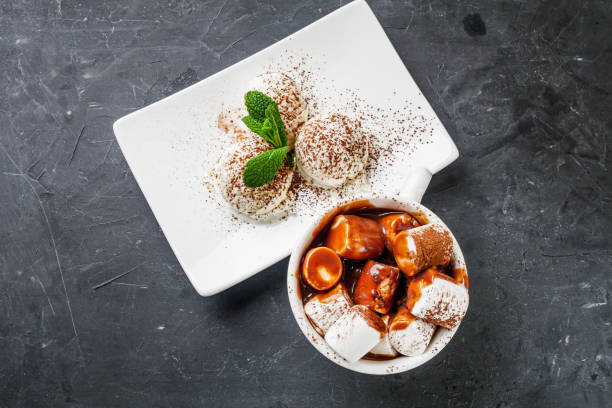 istock hot chocolate with marshmallows and ice cream balls on a black background 1393164699