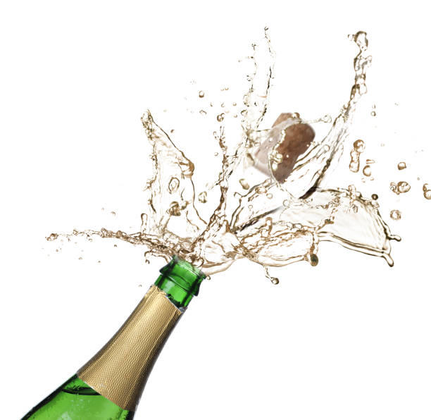 istock Sparkling wine splashing out of bottle on white background 1393164805