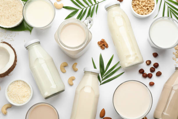 istock Different vegan milks and ingredients on white background, flat lay 1393165695
