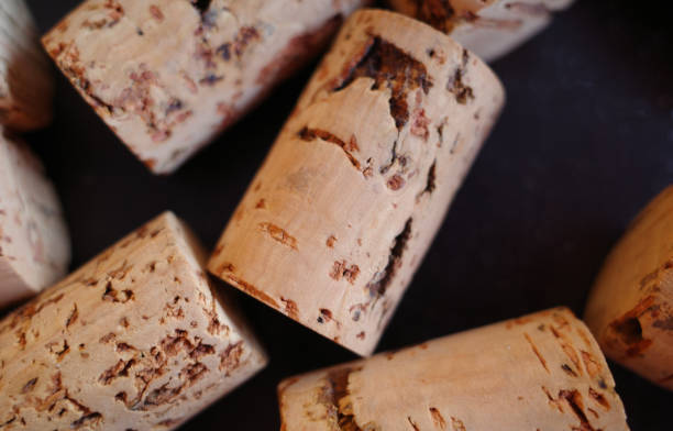 istock Brown corks of bottles on a black background 1393165834
