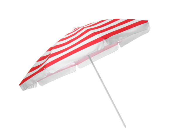 istock Open red striped beach umbrella isolated on white 1393166031