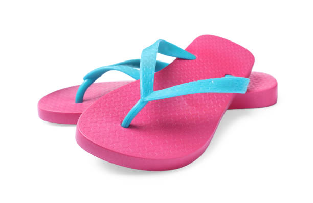 istock Pair of pink flip flops isolated on white 1393167160