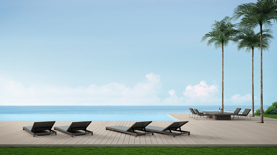 Sunbeds and dining table on wooden floor deck with infinity edge swimming pool.3d rendering