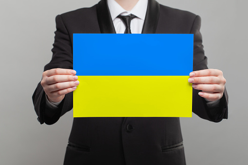 Businesswoman with Ukrainian flag banner