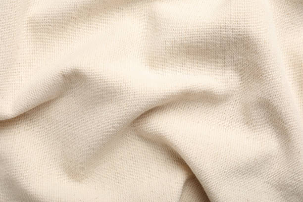 istock Beige hemp cloth as background, top view. Natural fabric 1393168548