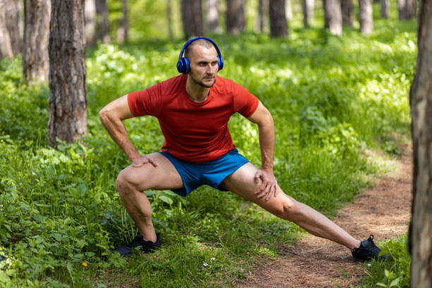 istock Hand amputee athlete doing stretch exercises in a forest 1393170109