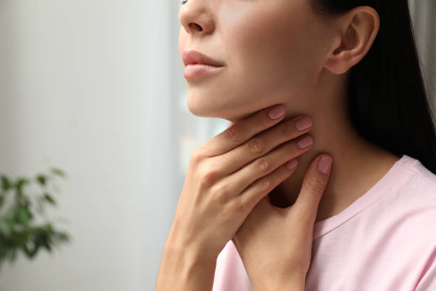 istock Young woman doing thyroid self examination indoors, closeup. Space for text 1393171404