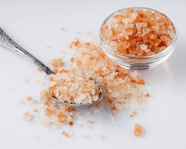 istock pink Himalayan salt on a white background 1393172551